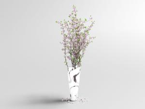 插在拼色花瓶里的桃花枝花瓶花卉
